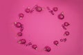 Pink Christmas ornaments on the pink background top view Royalty Free Stock Photo