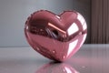 Pink chrome heart shape object on plain background