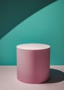 Pink circular display plinth against a green wall