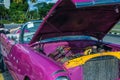 A pink classic car in Cuba