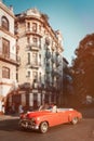 Pink classic car and old buildings in downtown Havana Royalty Free Stock Photo