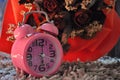 Pink clock and dried red roses Royalty Free Stock Photo