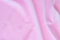 Pink cloth background abstract with tangled soft waves Royalty Free Stock Photo