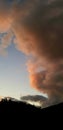 Pink cloud in sunset on blue sky, Sardinia.