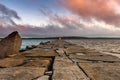 Pink Clouds Over Long Walkway to Lighthouse