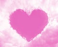 Pink clouds in the sky like frame with heart shape. romantic fairy tale abstract background
