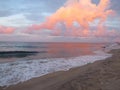 Pink clouds at sunset on the beach Royalty Free Stock Photo