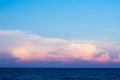 Pink clouds and sunset sky over sea Royalty Free Stock Photo