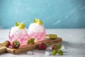 Pink cocktail with lime, crushed ice, strawberries and mint on the light background, selective focus image, copy spice for you Royalty Free Stock Photo