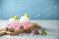 Pink cocktail with lime, crushed ice, strawberries and mint on the light background, selective focus image, copy spice for you Royalty Free Stock Photo