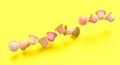 Pink coffee capsules on a yellow background