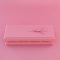 pink coffin isolated on pink background