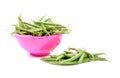 Pink colander with long green beans