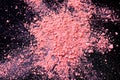 Pink color dust particles splattered on black background Royalty Free Stock Photo