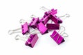 Pink color binder clips isolated Royalty Free Stock Photo