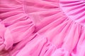 Pink color chiffon fabric folds. Rose dress with ruffles and frills Royalty Free Stock Photo