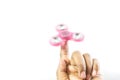 pink color fidget spinner on hand moving