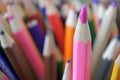 Pink color pencil standing out from the crowd concept Royalty Free Stock Photo