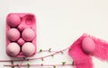 Pink colored easter eggs in pink box, with pink decoration, on w Royalty Free Stock Photo
