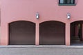 Pink colored house with two car garage