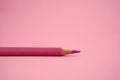 Pink Colored Pencil isloated on pink background. Royalty Free Stock Photo