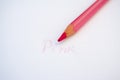 Pink colored pencil on white background Royalty Free Stock Photo