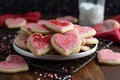 Pink colorful heart cookies on table. Generate Ai