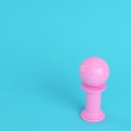 Pink column with soccer ball on bright blue background in pastel Royalty Free Stock Photo