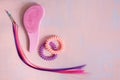 Pink comb, purple bright hair. Decoration for teenage girls. Silicone rubber band Royalty Free Stock Photo