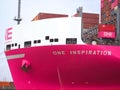 Pink container ship ONE inspiration of the shipping company Ocean network express at terminal Burchardkai at the port oh Hamburg