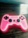 A pink controller light with neon lights on it Royalty Free Stock Photo