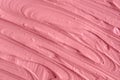 Pink cosmetic clay facial mask, cream texture close up, selective focus.