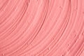 Soft pink cosmetic clay facial mask, cream texture close up, selective focus. Abstract background with brush strokes. Royalty Free Stock Photo