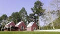 Pink cottage on green lawn field Royalty Free Stock Photo