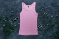 Pink cotton tank top mockup on dark background Blank plain t-shirt template for creative design Female summer sunglasses Royalty Free Stock Photo