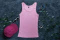 Pink cotton tank top mockup on dark background Blank plain t-shirt template for creative design Female summer sunglasses Royalty Free Stock Photo
