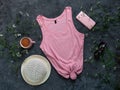 Pink cotton tank top mockup on dark background Blank plain t-shirt template for creative design Female summer sunglasses Royalty Free Stock Photo