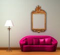 Pink couch with standard lamp and antique frame