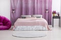 Pink coverlet on bed Royalty Free Stock Photo