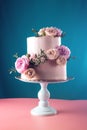 Pink cream wedding cake decorated with fresh roses Royalty Free Stock Photo