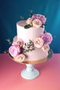 Pink cream wedding cake decorated with fresh roses Royalty Free Stock Photo