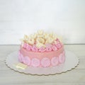 A pink creamchease cake with flowers for 5 year birhtday Royalty Free Stock Photo