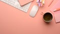 Pink creative study table with computer keyboard, mouse, school elements and copy space