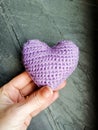 Pink crochet heart in hand Royalty Free Stock Photo