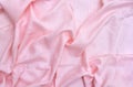 Pink crumpled linen textile cloth texture. Flat lay, top view Royalty Free Stock Photo