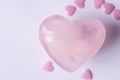 Pink Crystal Quartz Heart Sugar Candy Sprinkles on White Background. Romantic Valentines Mother`s Day Charity