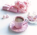 Pink cup with coffee, marshmallows hearts, gift and bouquet of pink roses Royalty Free Stock Photo