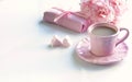 Pink cup with coffee, marshmallows hearts, gift and bouquet of pink roses Royalty Free Stock Photo