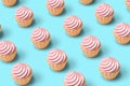 Pink cupcakes pattern background.