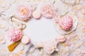 Pink cupcakes with roses and holiday decor in frame. Festive and bright. Wedding Celebration concept. Copy space. Royalty Free Stock Photo